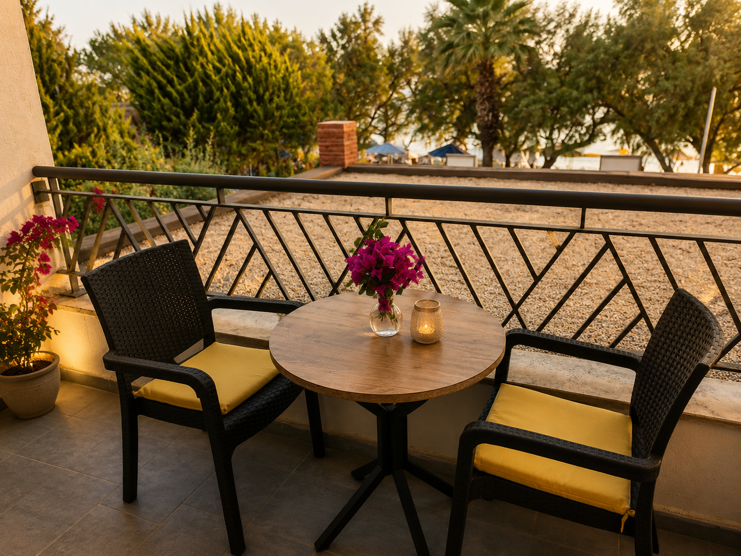 Superior room balcony at sunset with bistro table