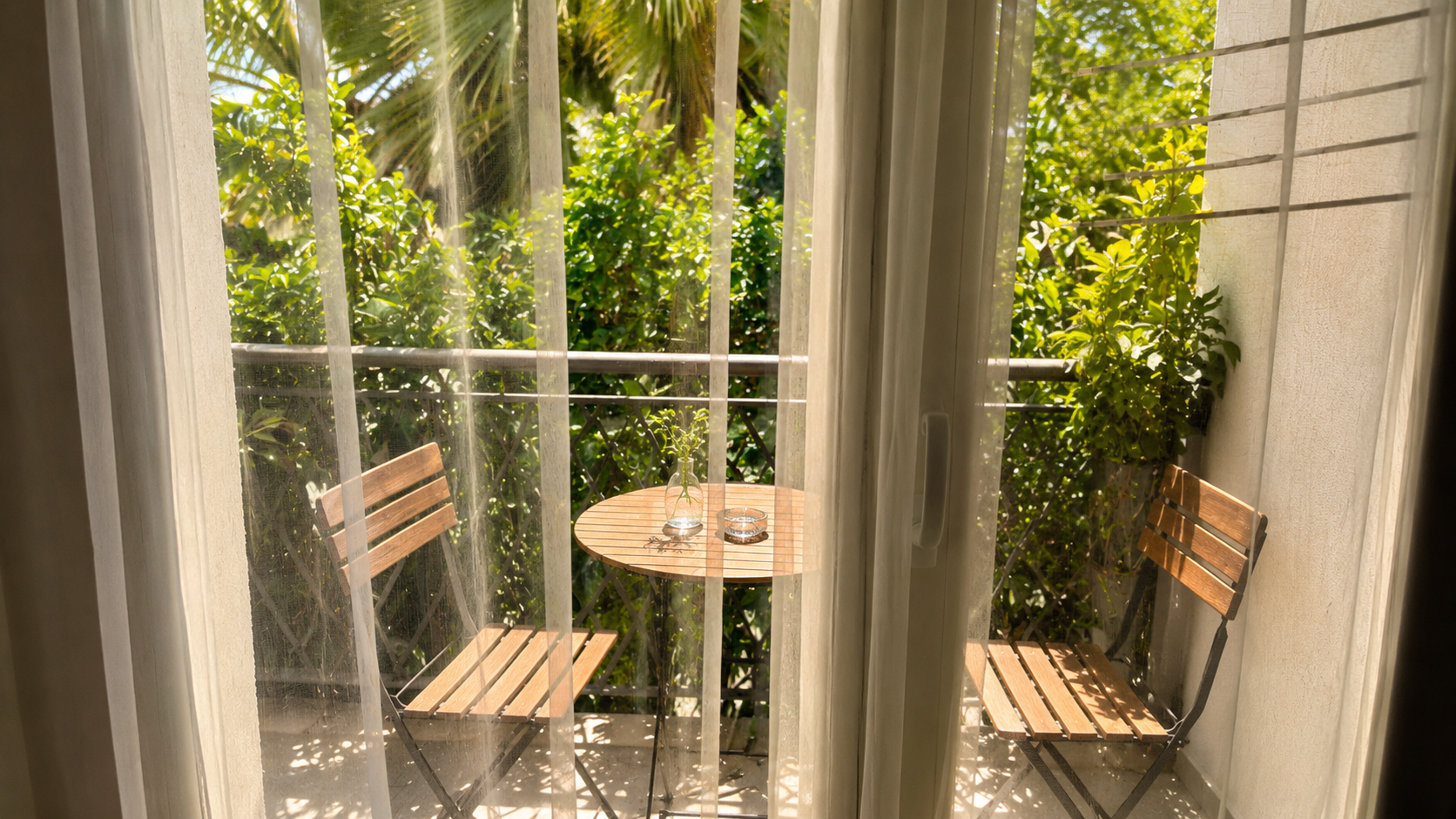 View through curtains onto the balcony