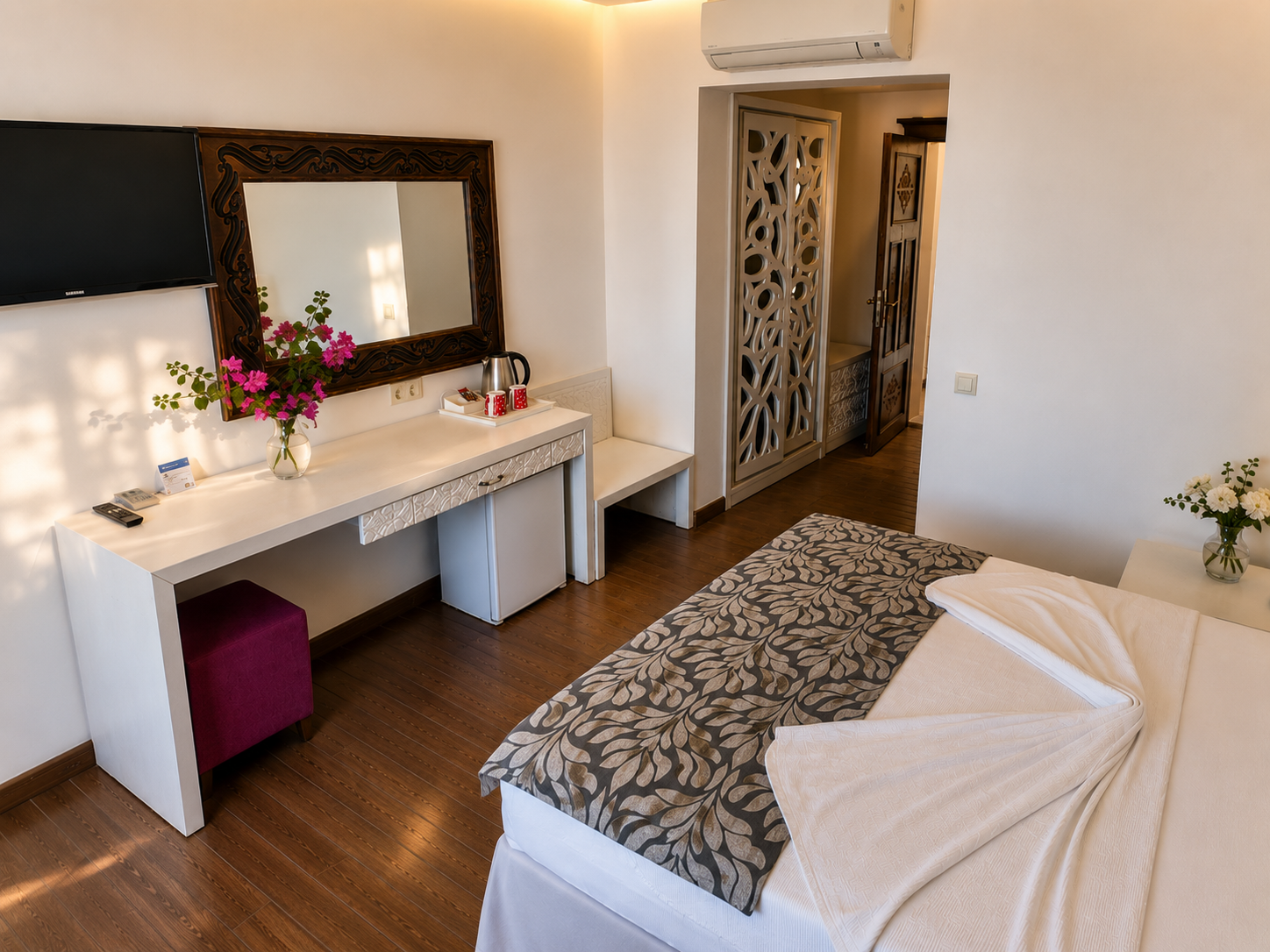 Superior room interior with vanity, TV, and mini fridge