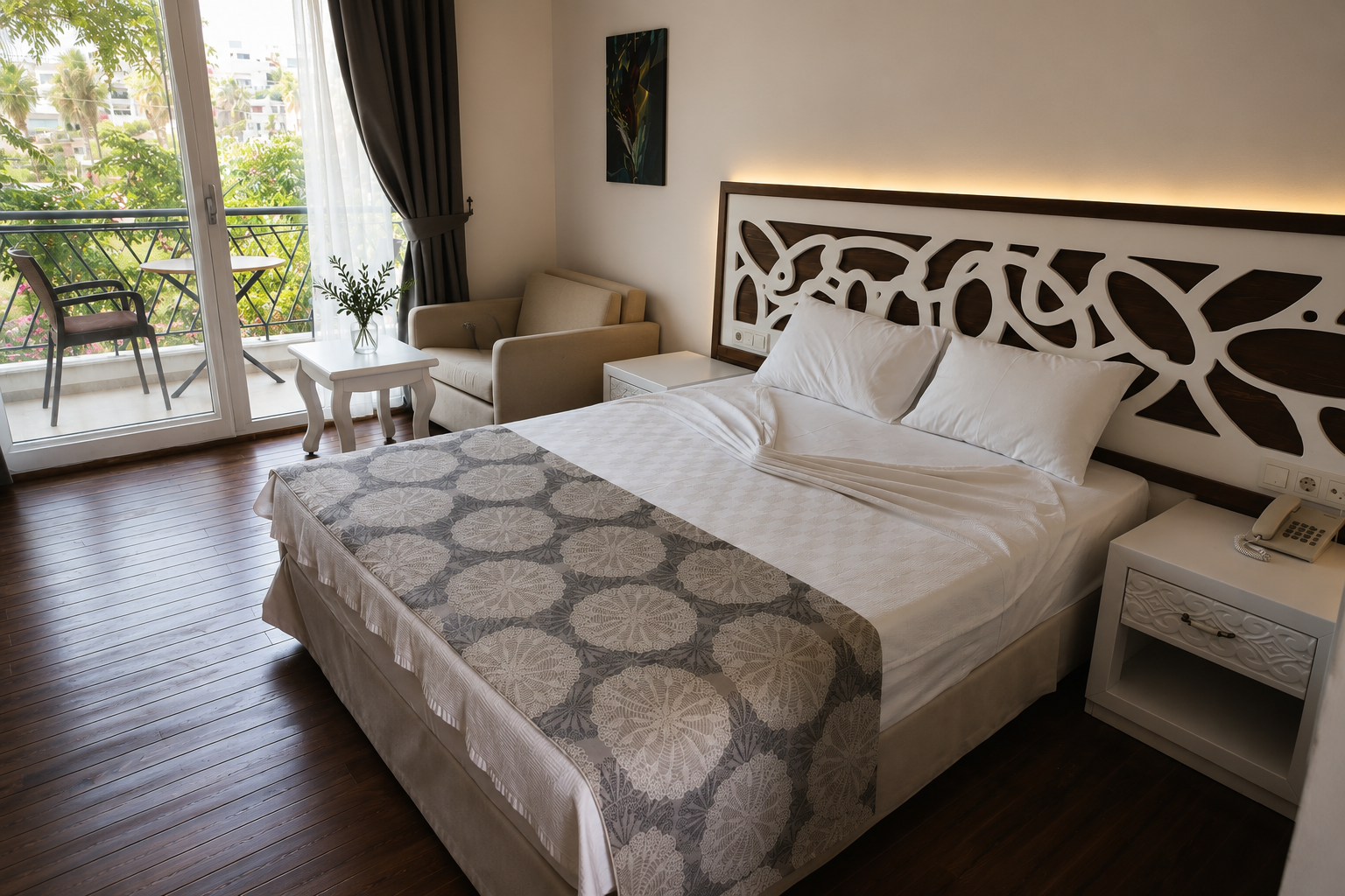 Deluxe room with queen bed and balcony seating area